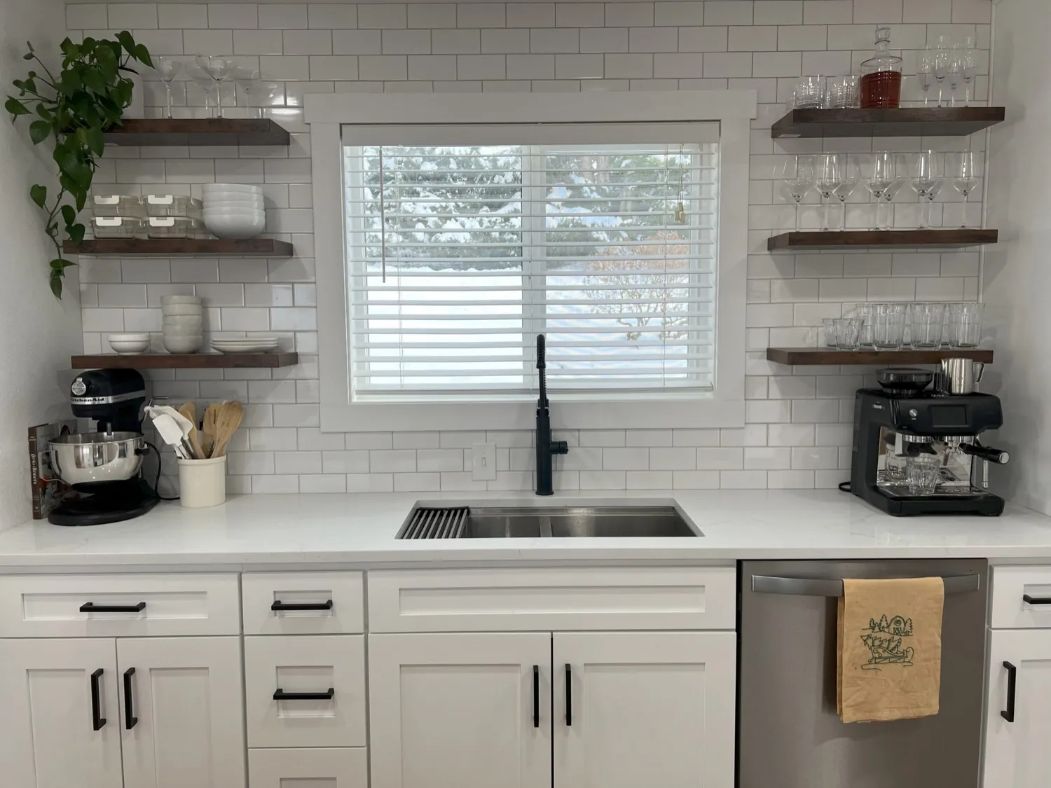 Designed kitchen with open wood shelving and quartz counters in Bellingham, WA